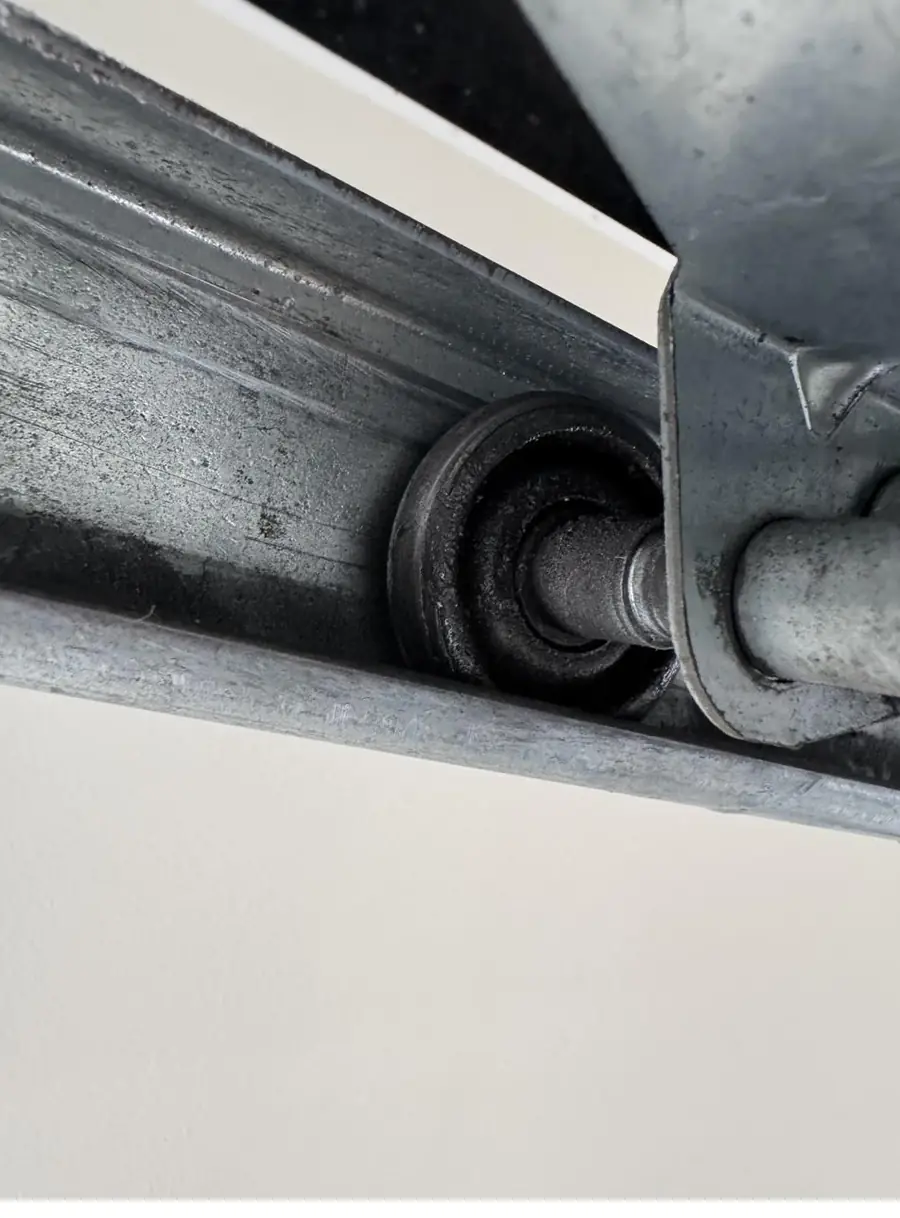 Nylon roller running in the garage door track